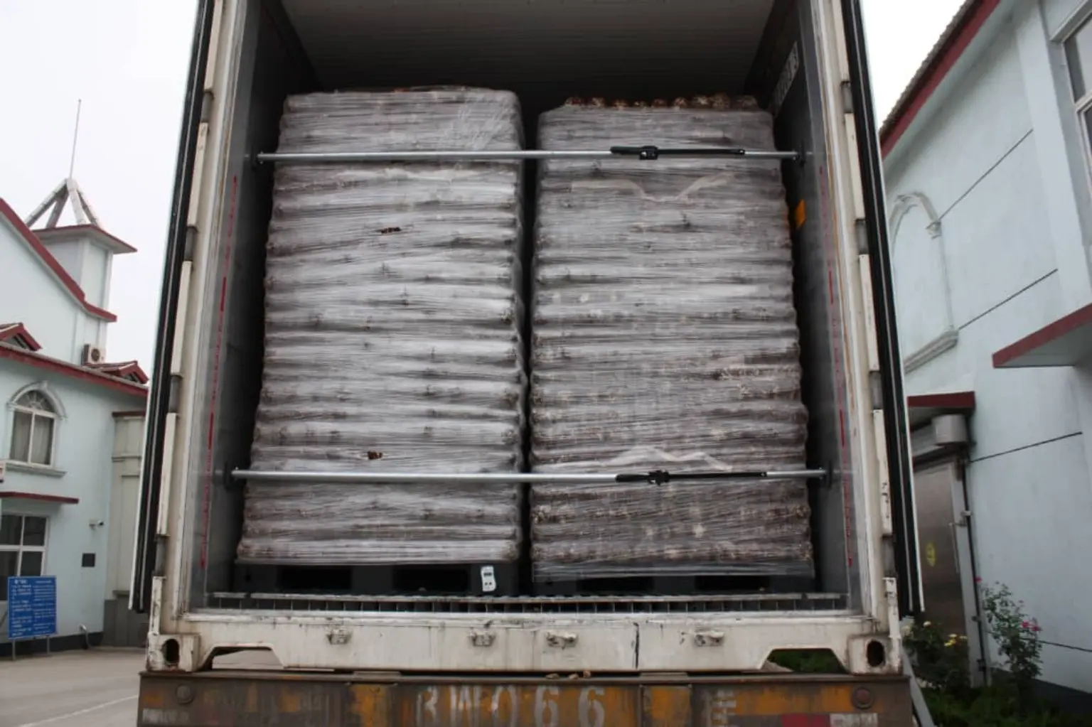 Reefer container secured with wrapped pallets of mushroom growing blocks
